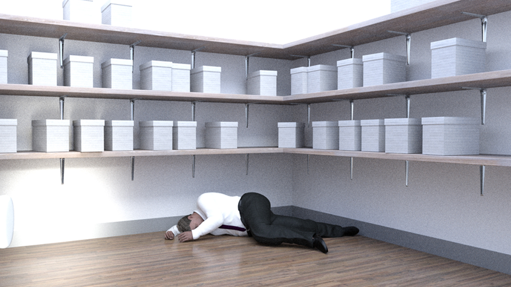 Person collapsed on a shop floor requiring first aid